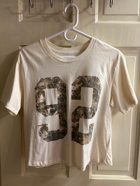 Rebellious One Cream Graphic Tee with Camo '93' Print